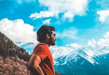man standing on mountain