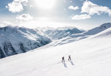 two man hiking on snow mountain