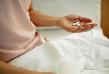 woman preparing for taking painkiller in hand